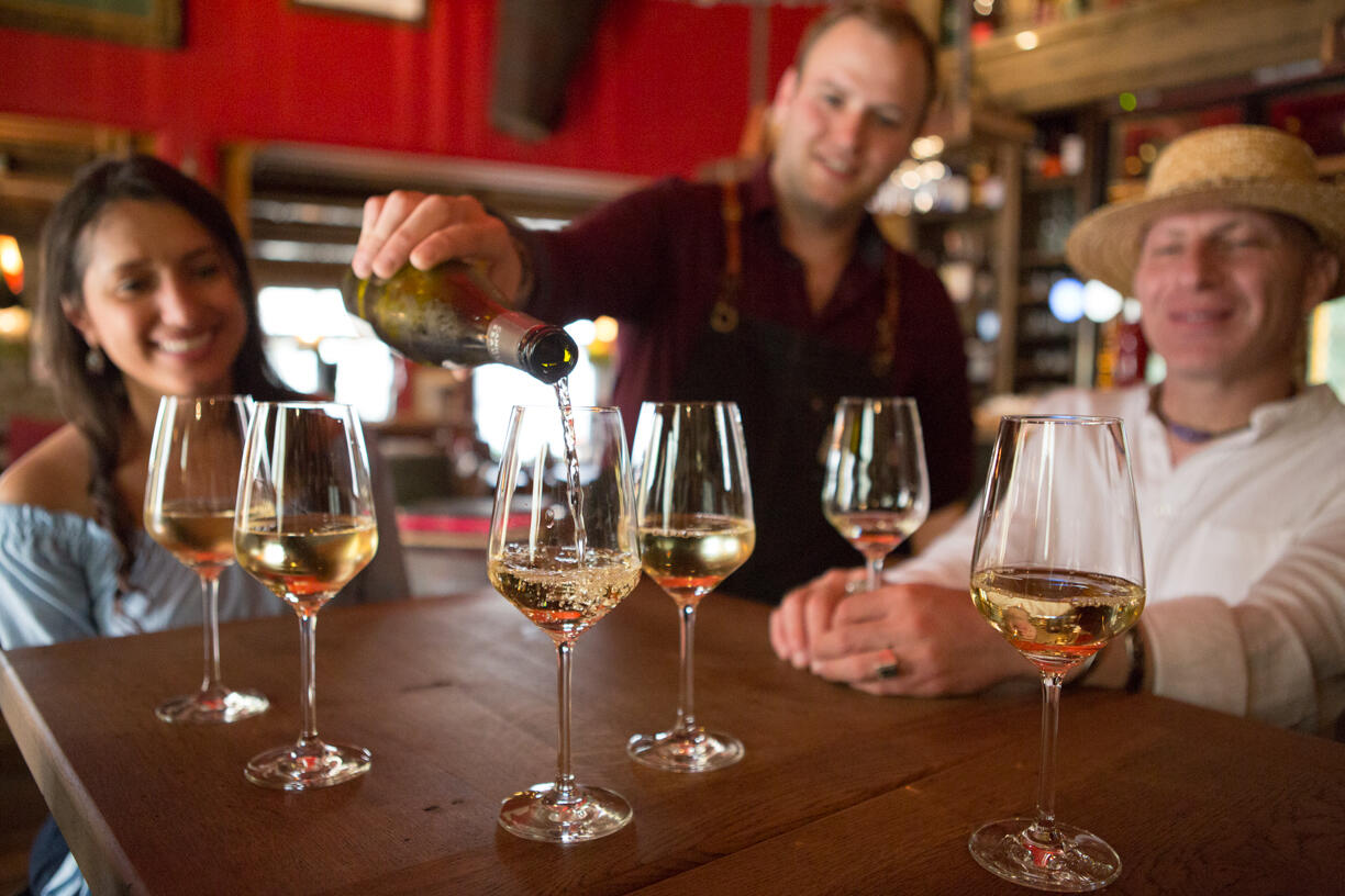 pouring white wine in strasbourg