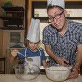Chef and little girl baking
