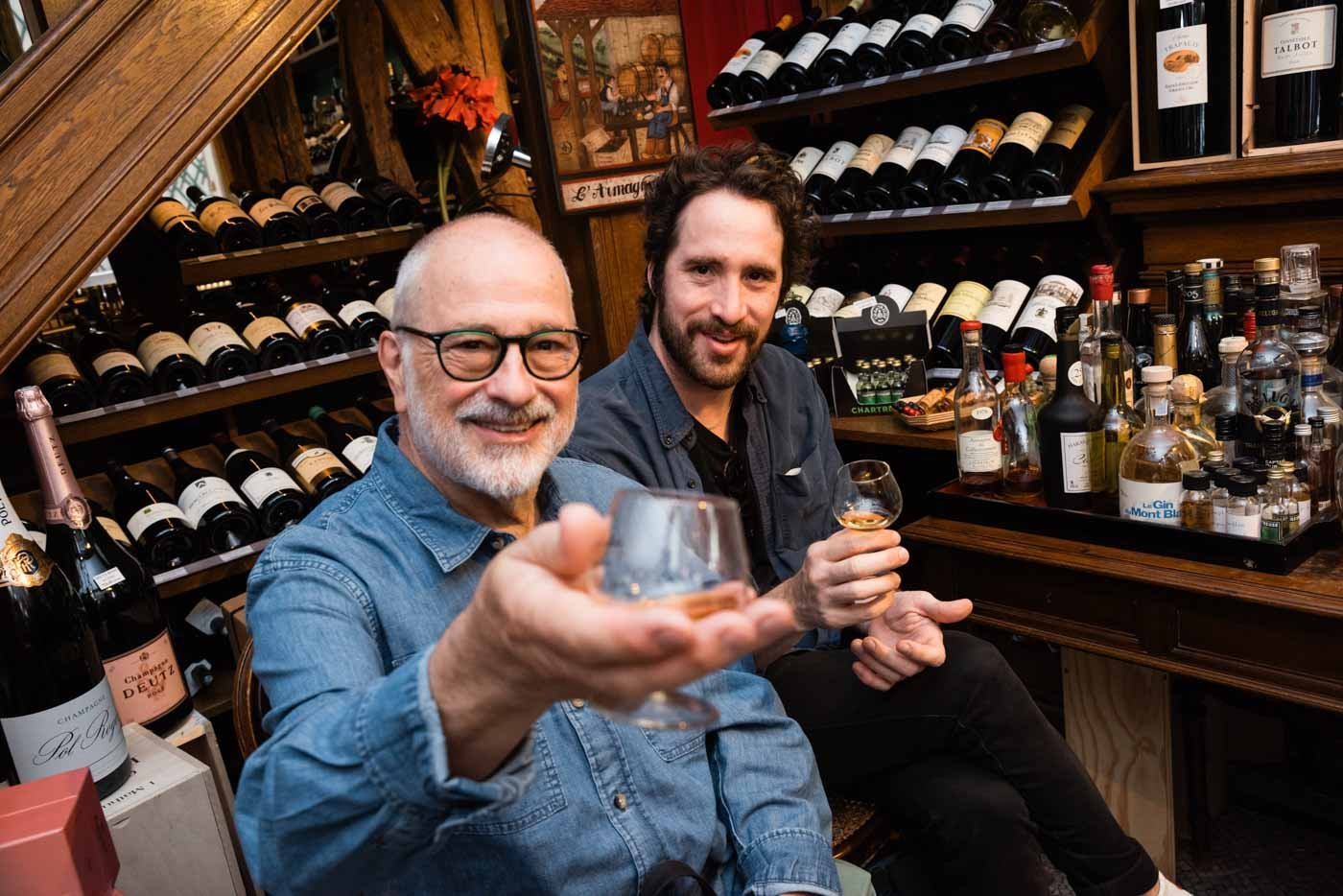 men_holding_glasses_at_Ryst_Dupeyron_Paris